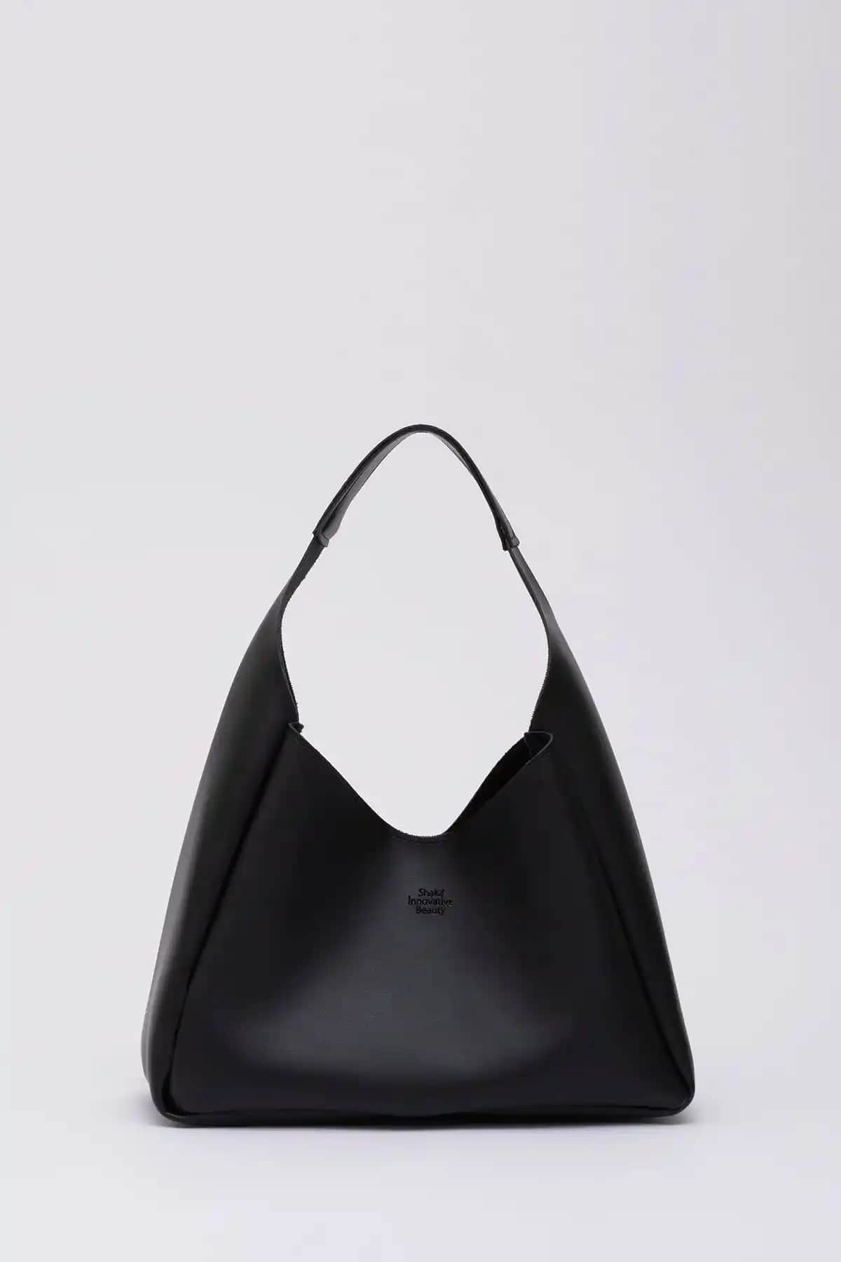 Shaka Siyah Çıtçıt Kapatmalı ve Shule Bags Tiger Small Çanta Karşılaştırması